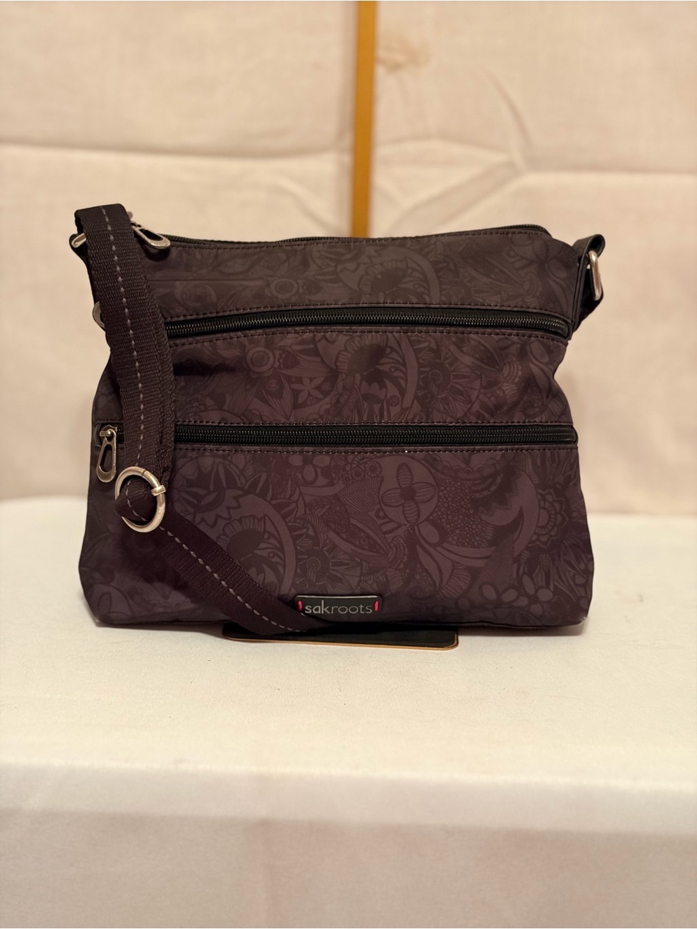 Sakroots Dark Brown Floral Pattern Crossbody Bag
